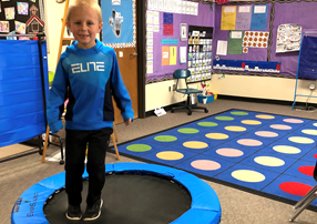 Student on fitness trampoline in classroom